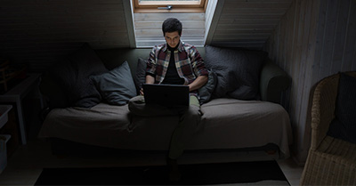 Man studying on his laptop.